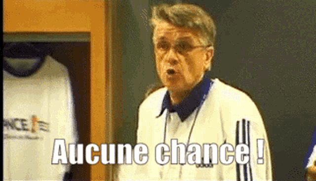 a man standing in a locker room with the words aucune chance written above him