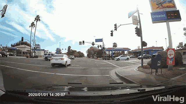 a car driving down a street with a sign that says unloaded