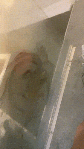 a reflection of a person 's face in a mirror