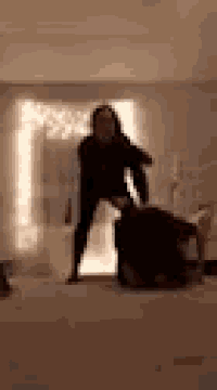 a blurry picture of a man standing next to a woman on the floor .