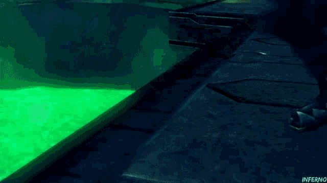 a video game character is laying on his back in a green liquid with the word inferno below him
