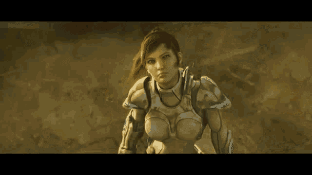 a woman is laying in the dirt with a sword .
