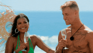a man and a woman toasting with champagne glasses