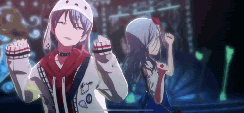 a couple of anime characters are standing next to each other in a dark room .
