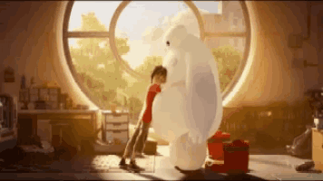 a boy is hugging a large white bear in front of a window