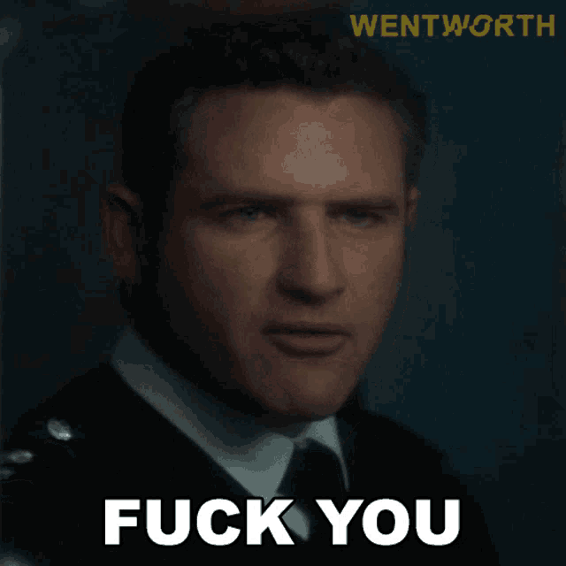 a close up of a man 's face with the words fuck you below him
