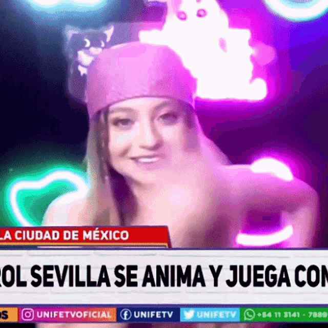 a woman with a cat on her head is on a news channel