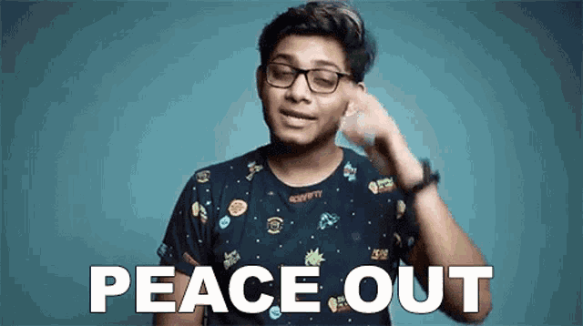 a young man wearing glasses and a black t-shirt says peace out .