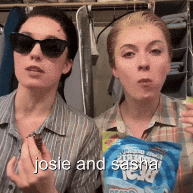 two women wearing sunglasses are eating a snack and the words josie and sasha are on the bottom