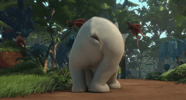a white elephant is standing on a dirt road