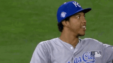 a baseball player for the kansas city royals is wearing a blue helmet