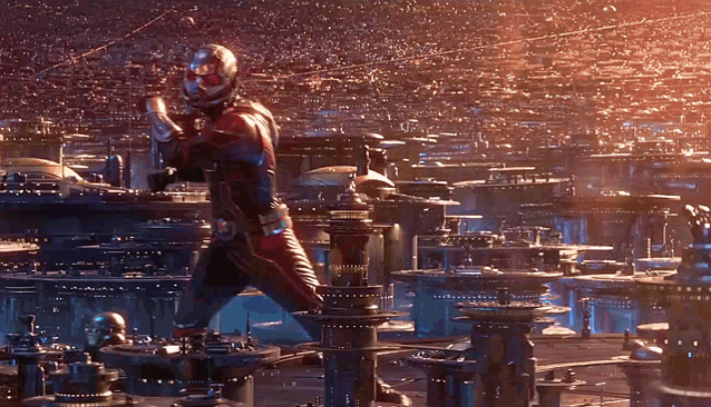 a man in a superhero costume is standing in front of a city