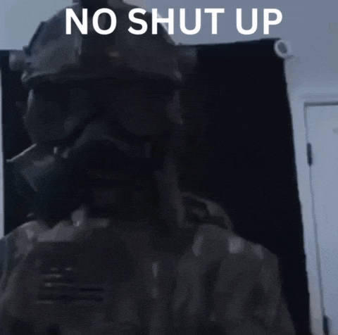 a person wearing a gas mask with the words " no shut up " above them