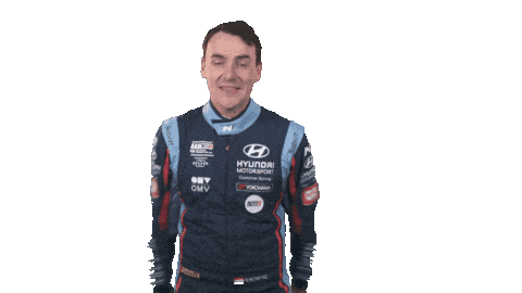 a man in a hyundai racing suit is holding his arms out