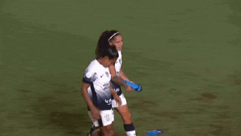 two female soccer players wearing jerseys with the letters ice on them