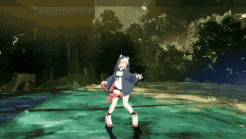 a girl in a hoodie with the letter t on it is dancing