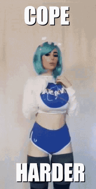 a woman with green hair is wearing a nasa shirt .