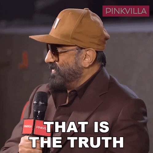 a man wearing a hat and sunglasses holds a microphone and says " that is the truth "