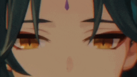 a close up of a person 's eyes with a purple decoration on their forehead .