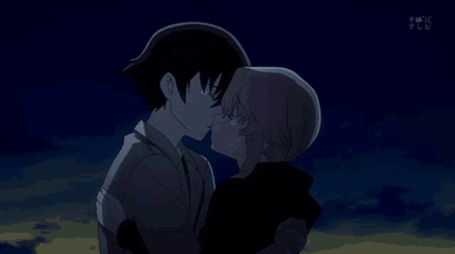 a man and woman kissing with tears running down their faces