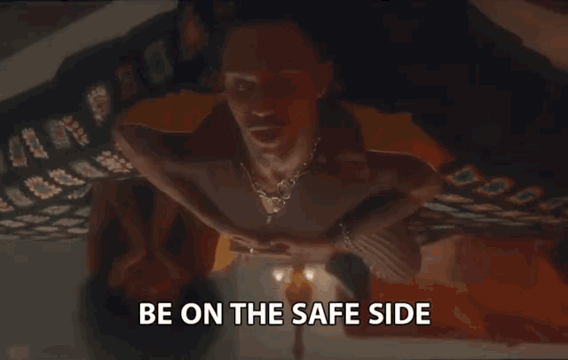 a man laying on a bed with the words be on the safe side