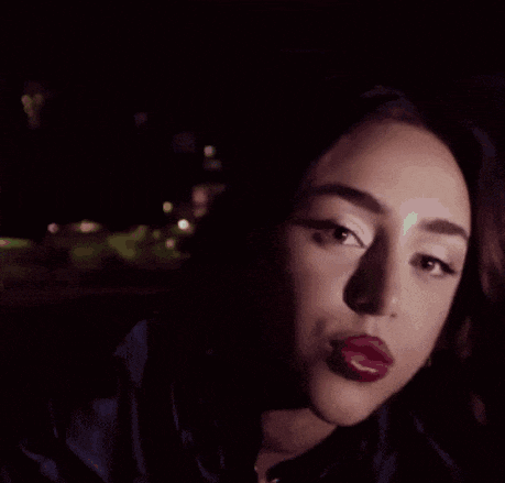 a blurry picture of a person 's face and hands