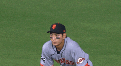 a san francisco giants baseball player is kneeling down on the field