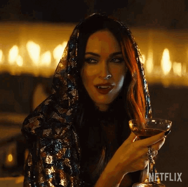 a woman holding a martini glass with a netflix logo in the corner