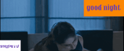 a woman is laying on a couch with the words good night written in blue