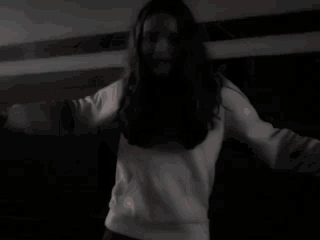 a blurry picture of a woman 's face with a man behind her