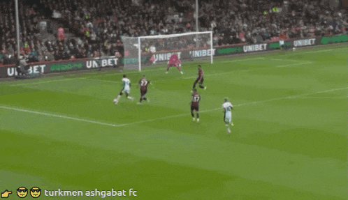 a soccer game is being played on a field with advertisements for unibet in the background