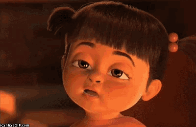 a cartoon girl with pigtails is making a funny face with her eyes closed
