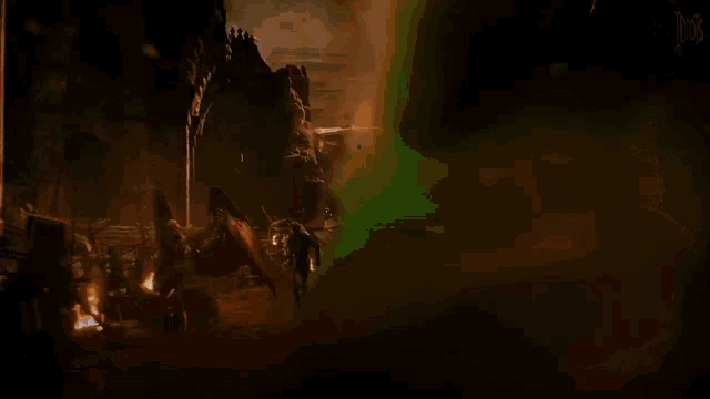 a person is standing in the middle of a forest with smoke coming out of it .