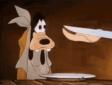 a cartoon dog is sitting at a table looking at a plate of food and a knife .
