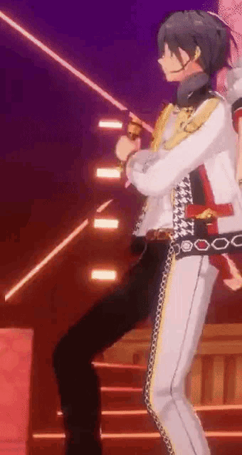 a man is standing on a stage holding a microphone and dancing .