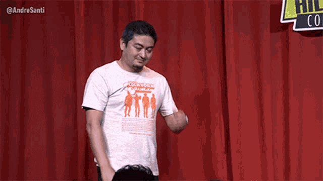 a man wearing a white shirt that says rock for a change on it