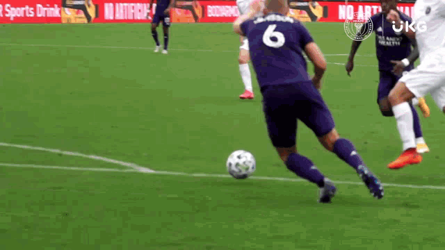 a soccer player with the number 6 on his back
