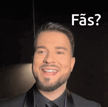 a man with a beard wearing a black suit and tie is smiling with the words fas below him