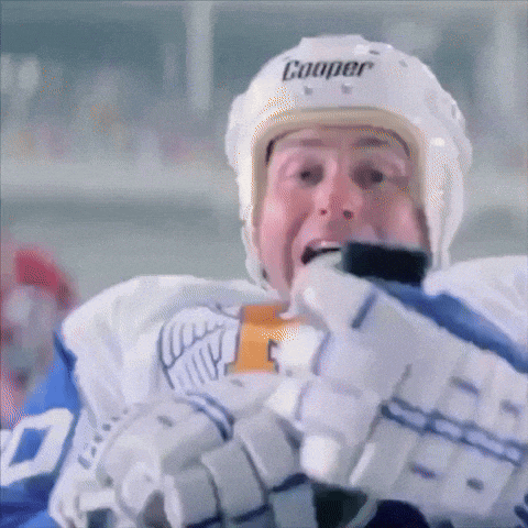 a hockey player with a cooper helmet on