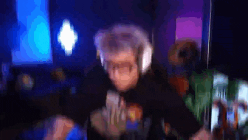 a blurry picture of a man wearing headphones and a t-shirt that says ' nintendo ' on it