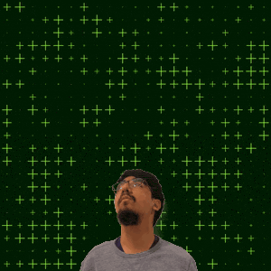 a man with a beard and glasses looks up at the number 22