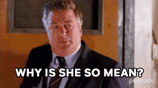 a man in a suit and tie is asking " why is she so mean "