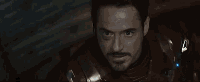a close up of iron man 's face with the words you just started a war