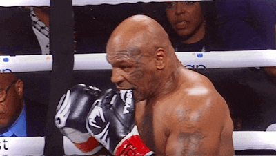 a boxer wearing a pair of gloves that say tyson