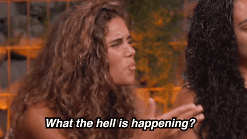 a woman says " what the hell is happening " while another woman looks on