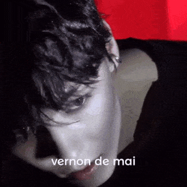 a close up of a person 's face with the words vernon de mai written on it
