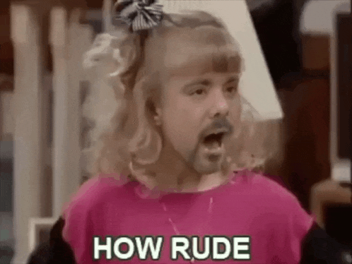 a man with a beard and blonde hair is wearing a pink shirt and a girl 's bow tie .