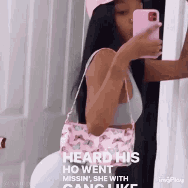 a woman taking a picture of herself in a mirror with the words heard his ho went missin '