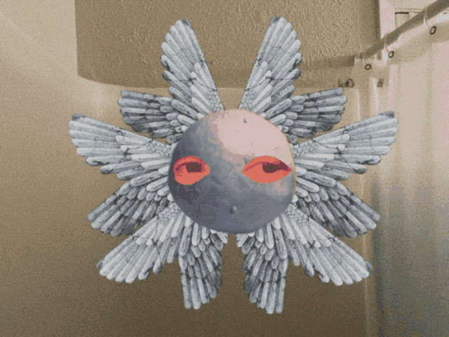 a drawing of a star with wings and red eyes