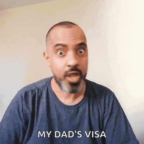 a man says my dad 's visa in front of a white wall
